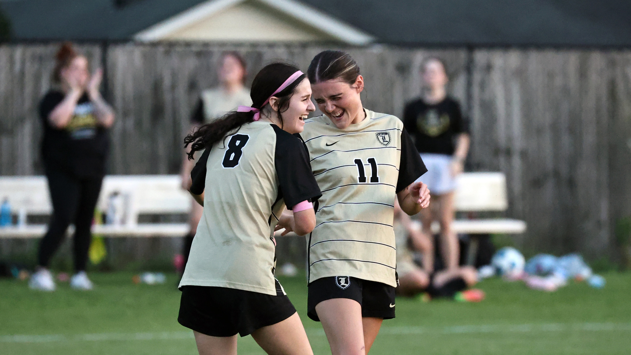 Lady Mustangs team members celebrate