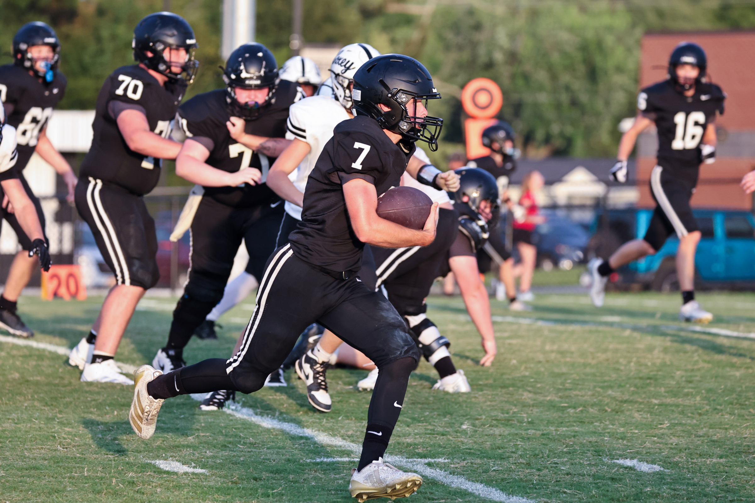 Elijah Chapman runs the ball up the field.