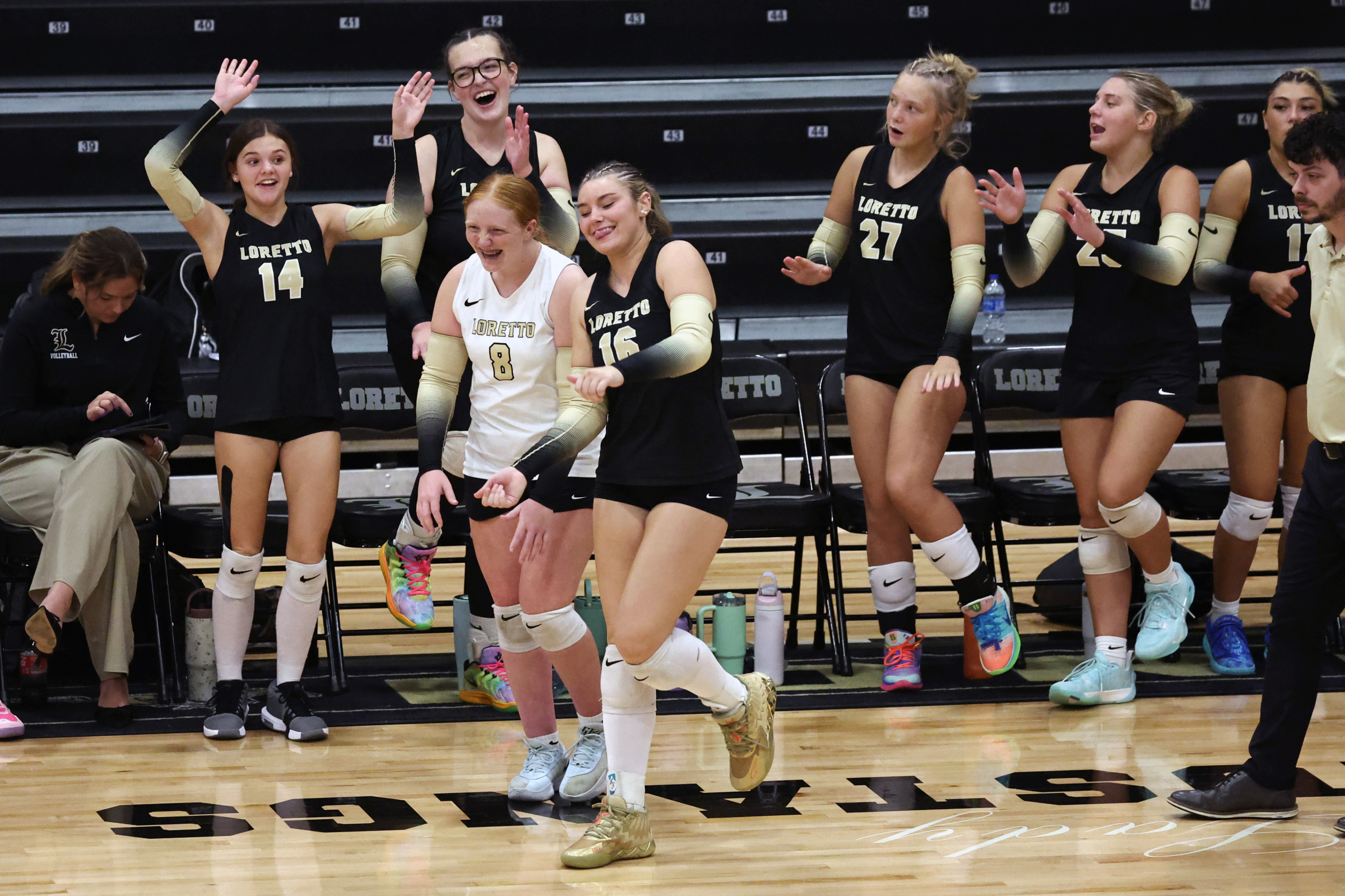 Lady Mustangs team members celebrate during the match vs. Spring Hill.