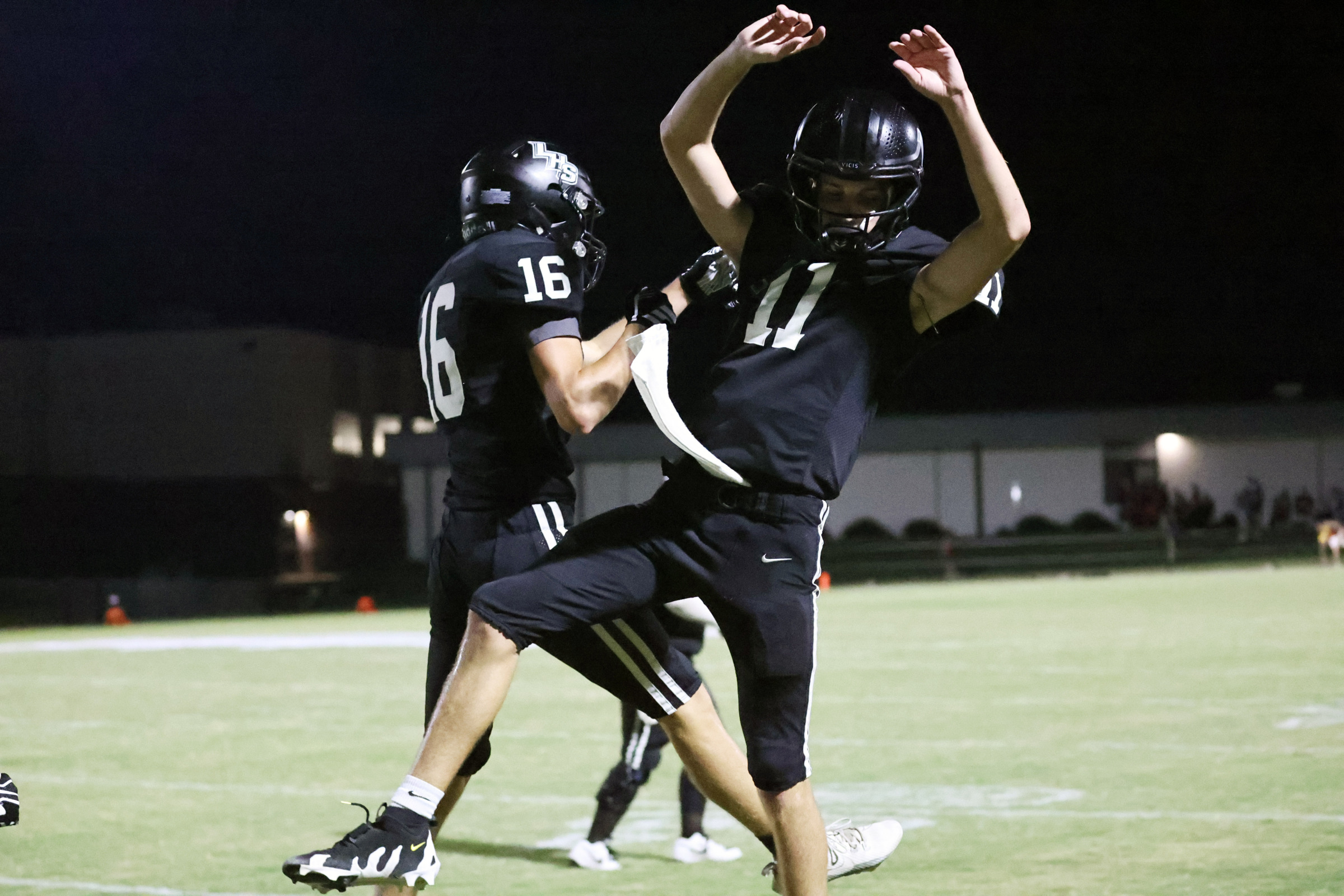 Loretto teammates celebrate a touchdown during Friday night's game.