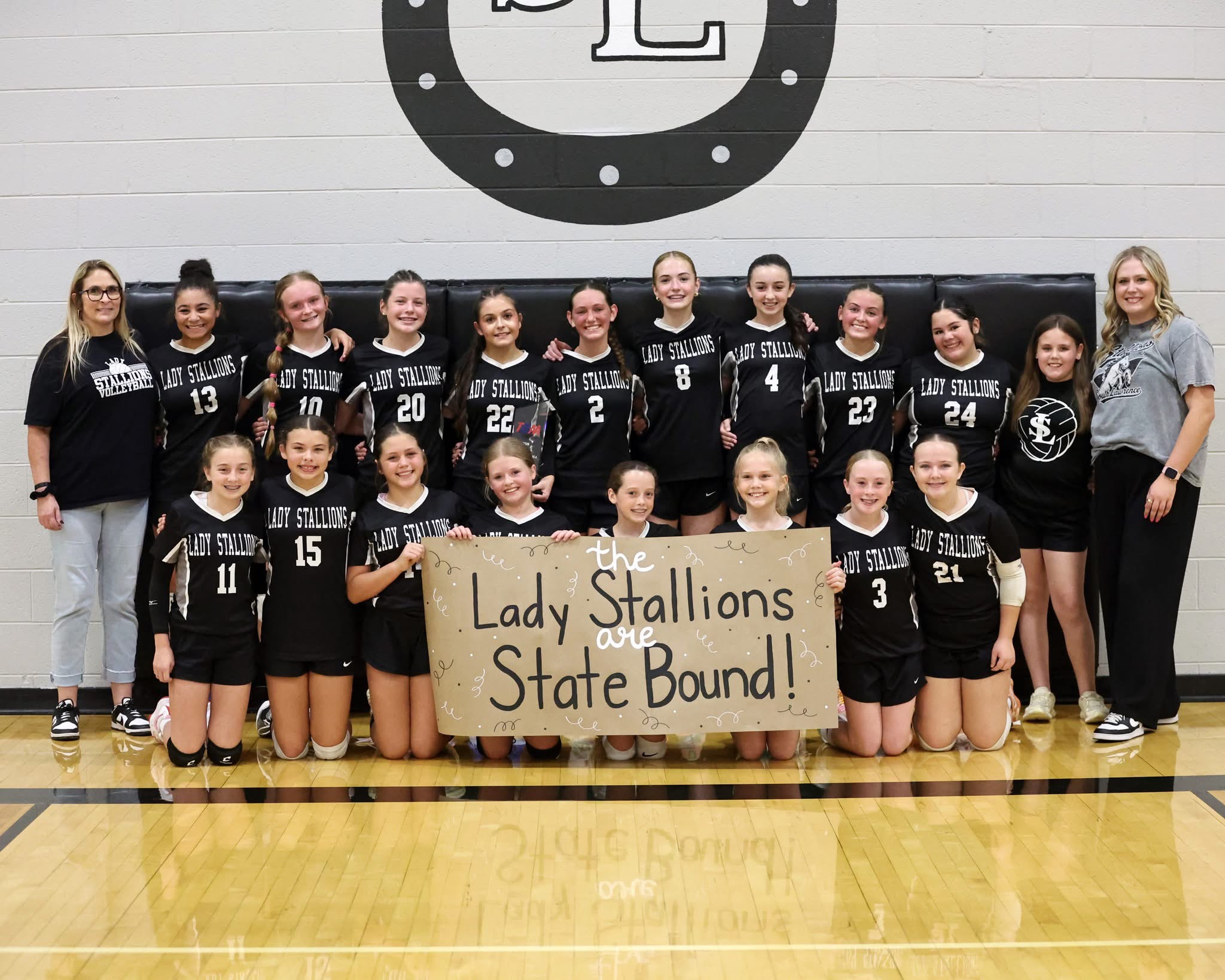 Members of the South Lawrence Volleyball team pose for a picture following their State Tournamemt birth.