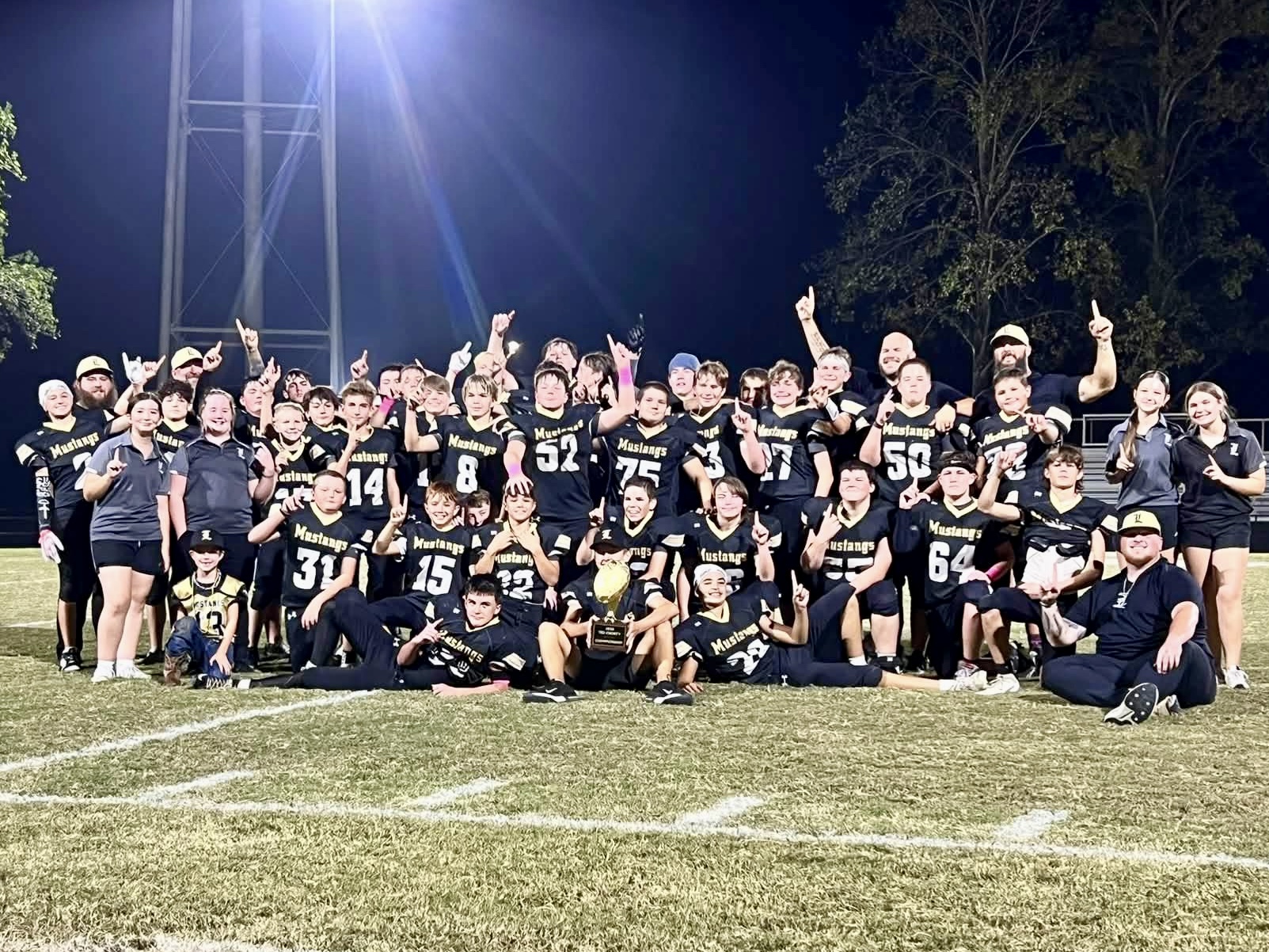 The Loretto Junior High Mustangs pose for a championship picture.