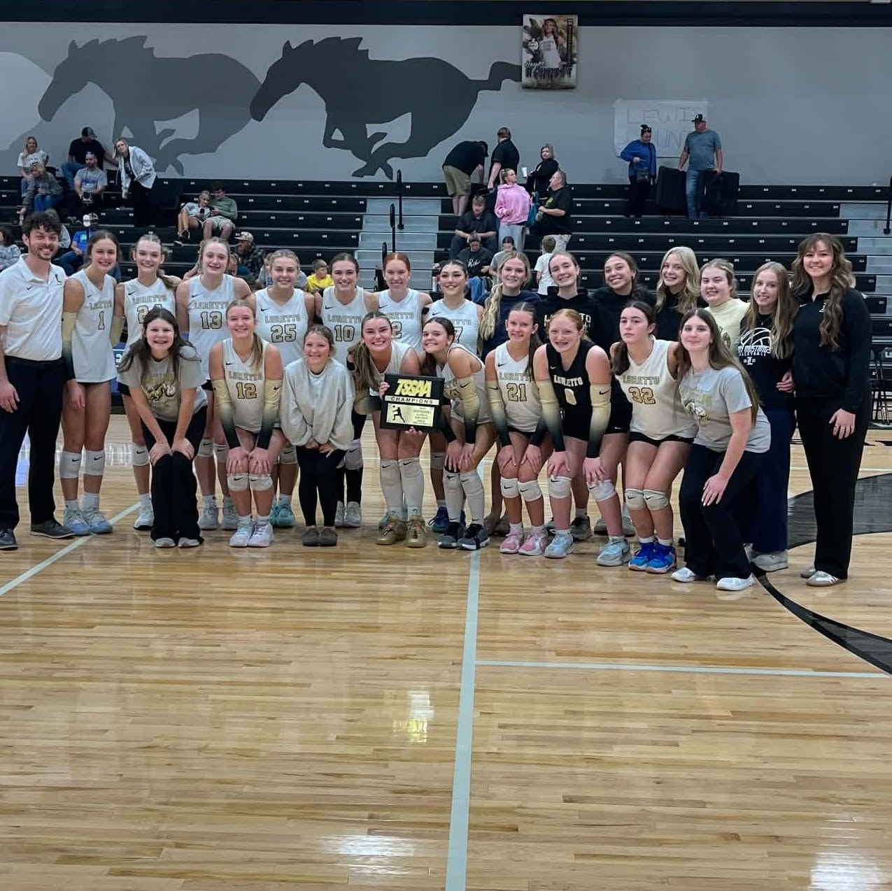 The Volleyball Lady Mustangs pose for a team shot earlier in tournament action