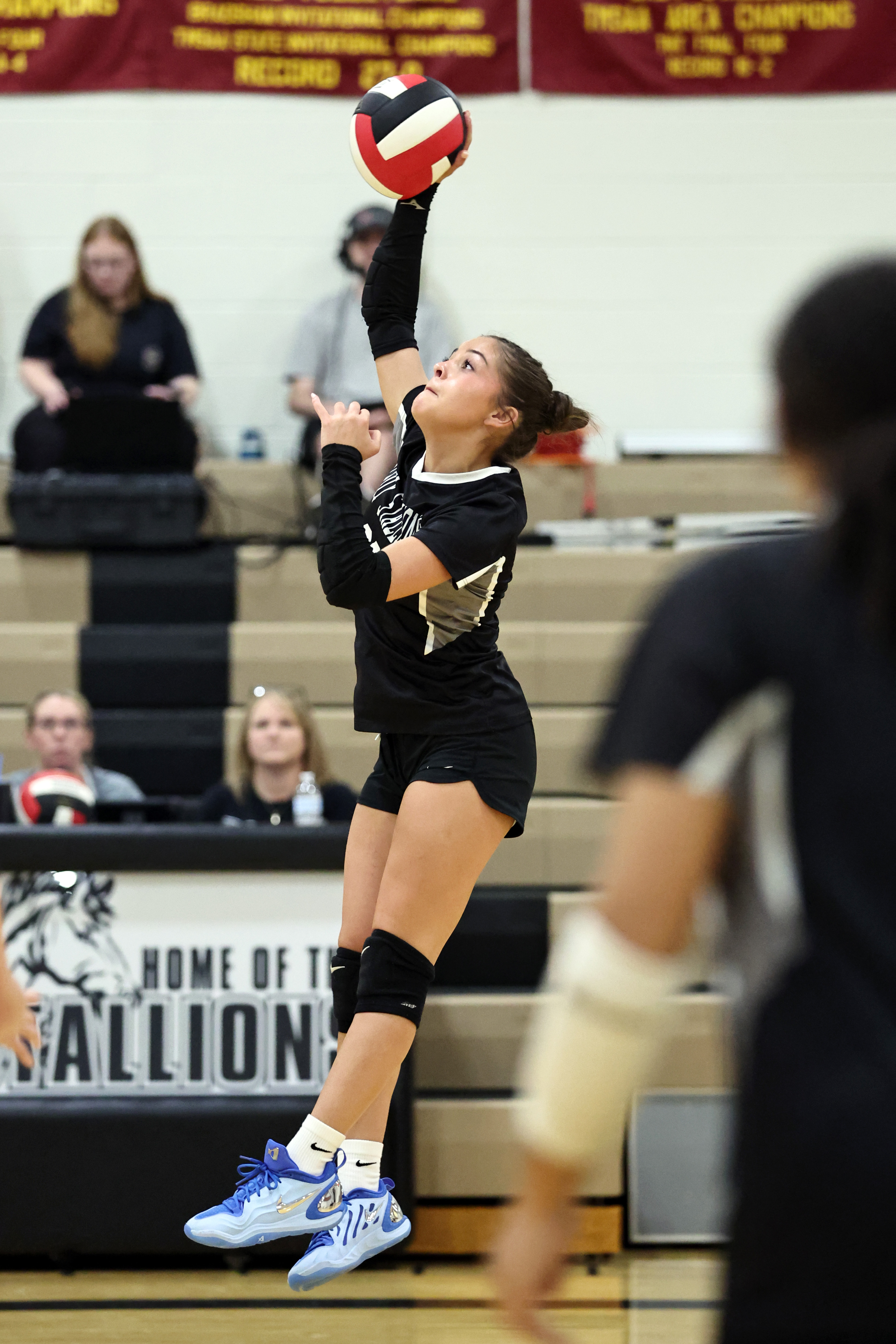 Izzy Methvin spikes it to the opponents side.