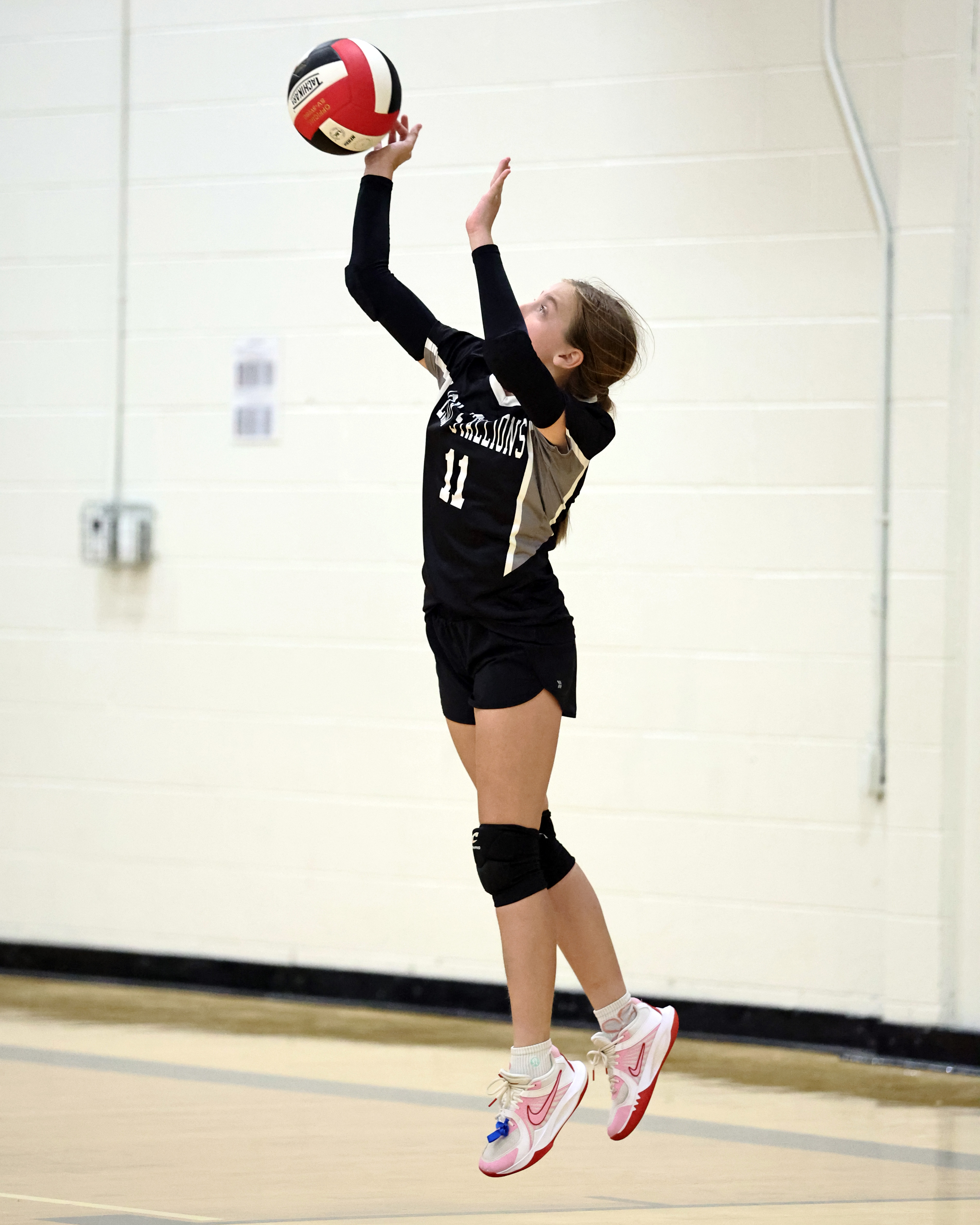 Baylor Kate Tipps serves it up in the JV game.