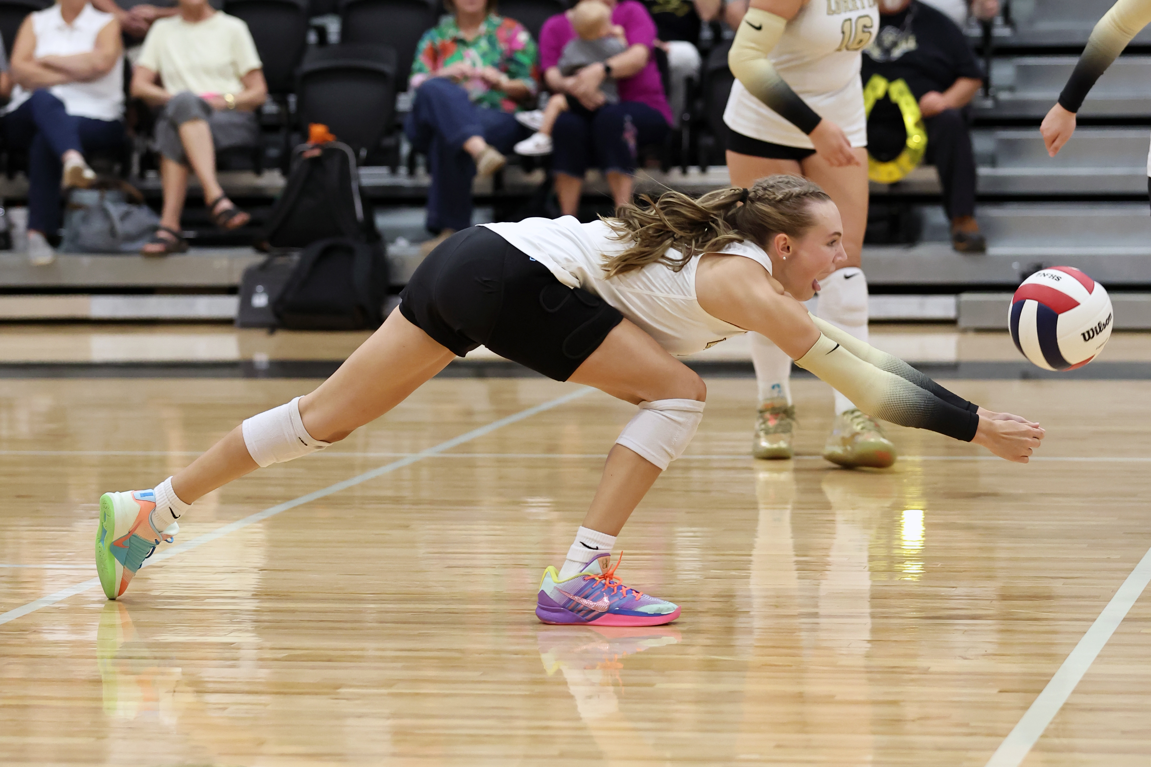 Shanna Fisher returns the ball for the Lady Mustangs