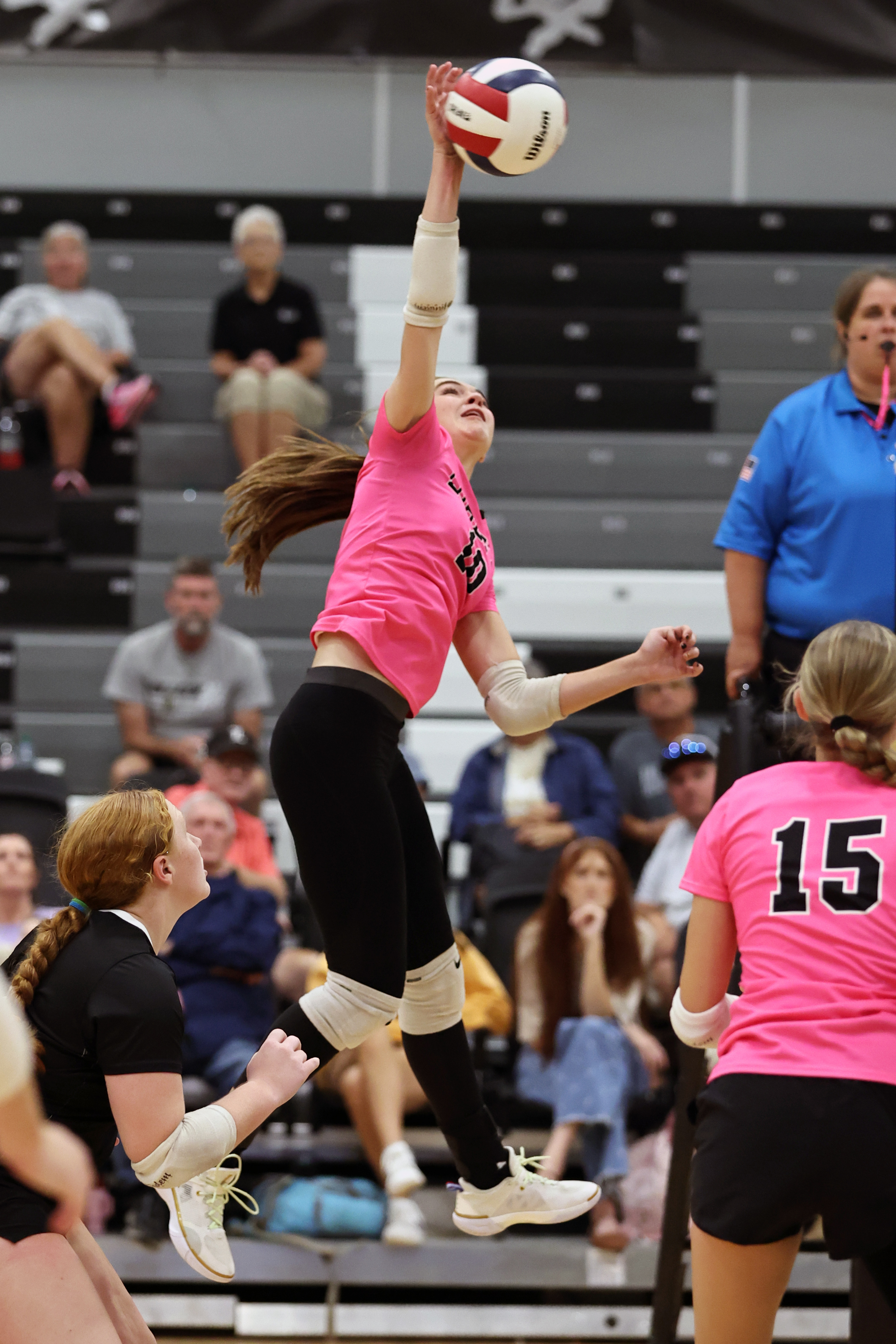 Bella Grace Sanderson hits the ball for one of her many kills.